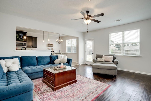 329 Baylor Dr, Graniteville, SC 29829 - living area with healthy amount of natural light, ceiling fan, a chandelier, and dark wood-style flooring