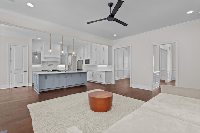 529 River Oaks Ln, Evans, GA 30809 - living room with a ceiling fan, crown molding, dark wood-type flooring, recessed lighting, and baseboards