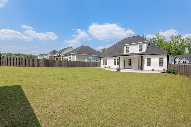 529 River Oaks Ln, Evans, GA 30809 - back of house featuring a patio area and roof with shingles