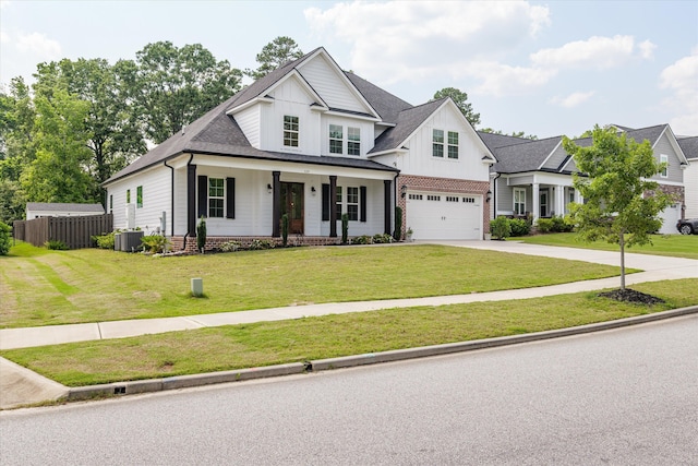529 River Oaks Ln, Evans, GA 30809 - modern farmhouse style home featuring board and batten siding, a garage, driveway, central AC unit, and covered porch