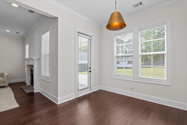 529 River Oaks Ln, Evans, GA 30809 - unfurnished dining area featuring ornamental molding, dark wood finished floors, a fireplace with raised hearth, baseboards, and recessed lighting
