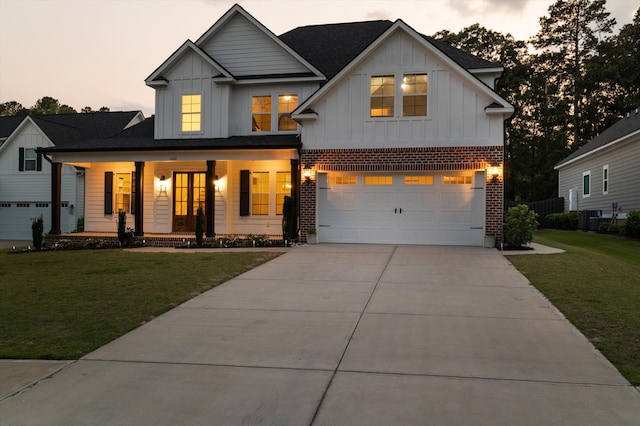 529 River Oaks Ln, Evans, GA 30809 - modern farmhouse with board and batten siding, an attached garage, covered porch, and a yard