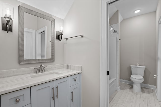 529 River Oaks Ln, Evans, GA 30809 - full bathroom with vanity, toilet, bathtub / shower combination, baseboards, and vaulted ceiling