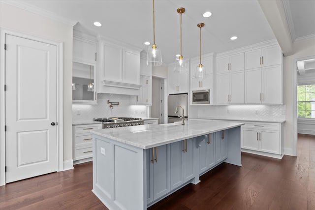 529 River Oaks Ln, Evans, GA 30809 - kitchen with stainless steel microwave, white cabinets, dark wood finished floors, crown molding, and recessed lighting