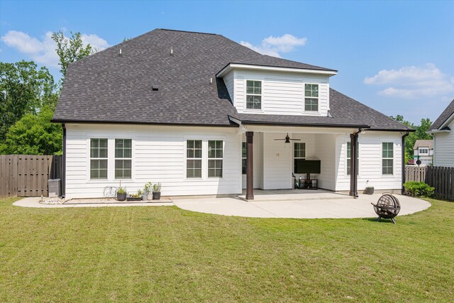 529 River Oaks Ln, Evans, GA 30809 - back of property with a ceiling fan, a shingled roof, a patio area, and a fire pit