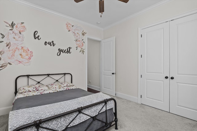 529 River Oaks Ln, Evans, GA 30809 - bedroom featuring carpet floors, ornamental molding, a closet, baseboards, and a ceiling fan