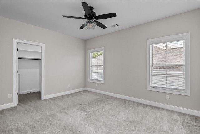 529 River Oaks Ln, Evans, GA 30809 - unfurnished bedroom featuring carpet floors, baseboards, a spacious closet, ceiling fan, and a closet