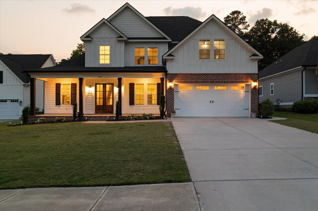 529 River Oaks Ln, Evans, GA 30809 - modern inspired farmhouse with board and batten siding, a garage, a porch, and a yard