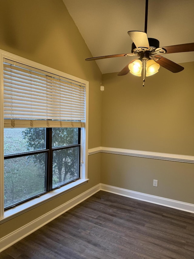 unfurnished room featuring dark hardwood / wood-style flooring, vaulted ceiling, and ceiling fan