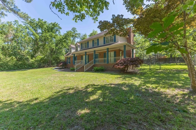 1116 Wrights Mill Rd, Aiken, SC 29801 - rear view of house with a porch and a chimney