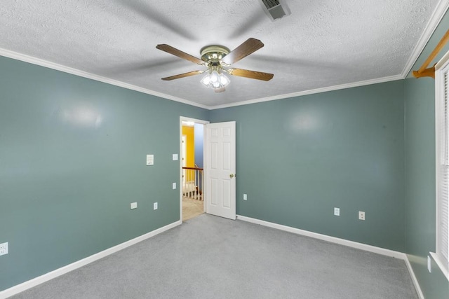1116 Wrights Mill Rd, Aiken, SC 29801 - spare room featuring baseboards, a ceiling fan, a textured ceiling, carpet, and crown molding