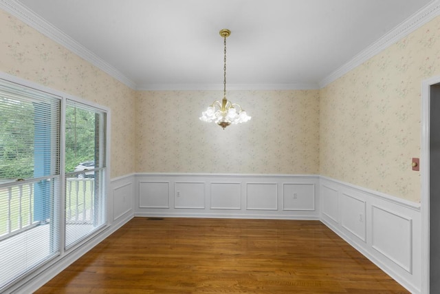 1116 Wrights Mill Rd, Aiken, SC 29801 - unfurnished dining area with a chandelier, wainscoting, wallpapered walls, wood finished floors, and crown molding