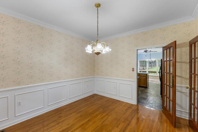 1116 Wrights Mill Rd, Aiken, SC 29801 - unfurnished room with a chandelier, wood finished floors, a wainscoted wall, ornamental molding, and wallpapered walls