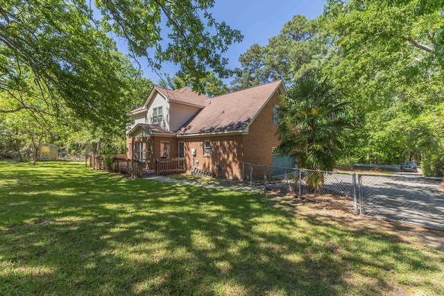 1116 Wrights Mill Rd, Aiken, SC 29801 - view of side of home with brick siding, a deck, and a shed
