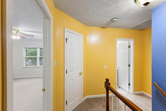 1116 Wrights Mill Rd, Aiken, SC 29801 - hall featuring an upstairs landing, carpet flooring, a textured ceiling, and baseboards