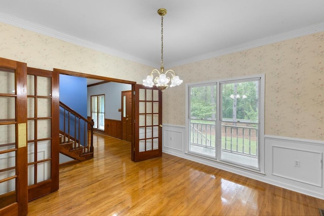 1116 Wrights Mill Rd, Aiken, SC 29801 - unfurnished dining area with wallpapered walls, a wainscoted wall, light wood-style flooring, stairs, and ornamental molding