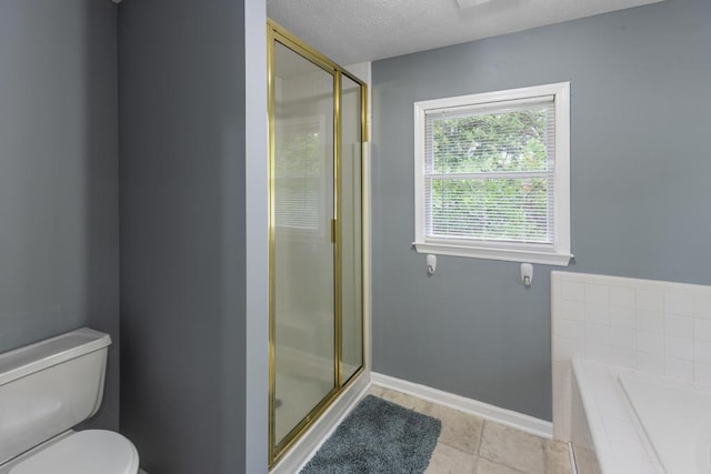 1116 Wrights Mill Rd, Aiken, SC 29801 - full bathroom with a shower stall, toilet, baseboards, a textured ceiling, and a relaxing tiled tub