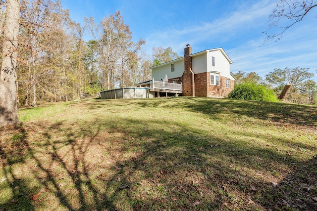 view of yard with a deck