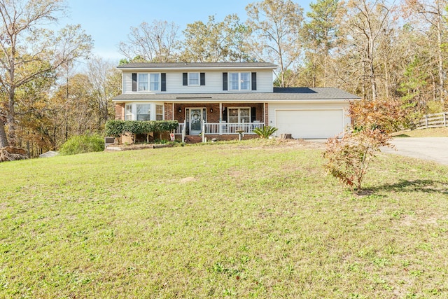 view of property with a porch, a garage, and a front lawn