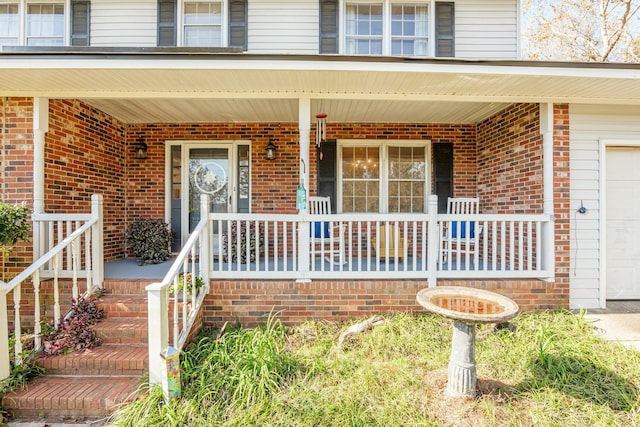 property entrance featuring a porch