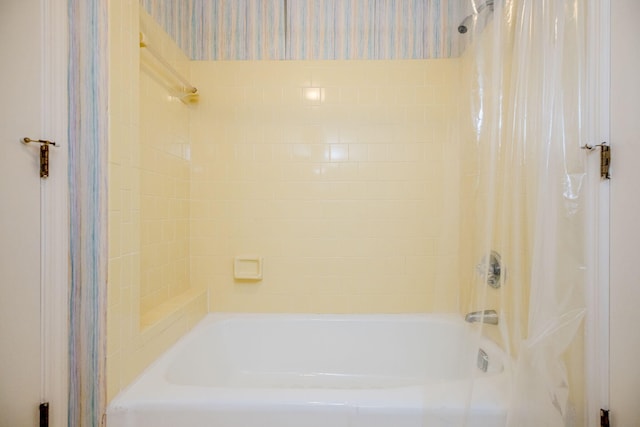 bathroom featuring shower / bath combination with curtain