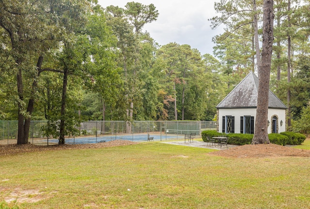 view of yard featuring tennis court