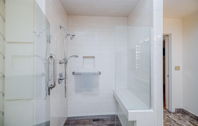 bathroom with tiled shower