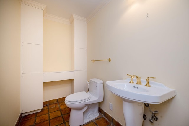 bathroom featuring toilet and crown molding