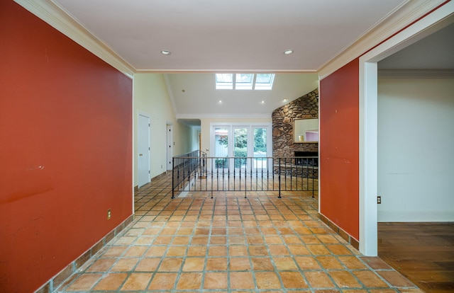 hall featuring vaulted ceiling and ornamental molding