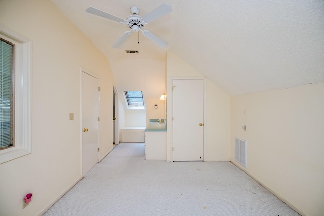 bathroom featuring vanity and vaulted ceiling with skylight