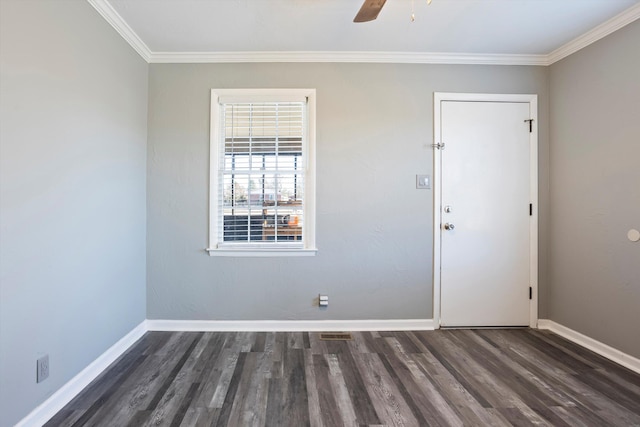 unfurnished room with crown molding, dark wood-type flooring, and ceiling fan