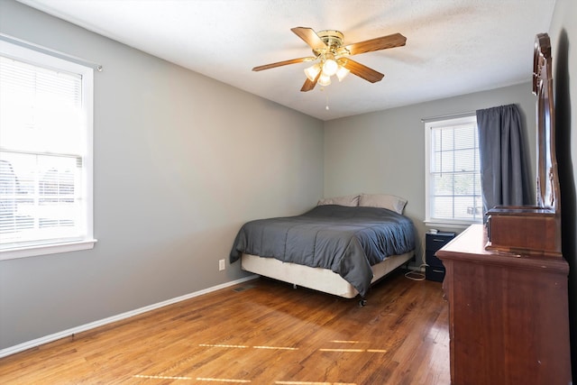 bedroom featuring dark hardwood / wood-style floors and ceiling fan