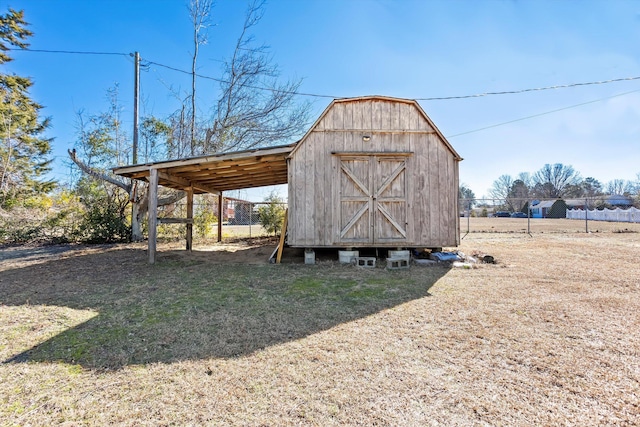 view of outbuilding with a lawn