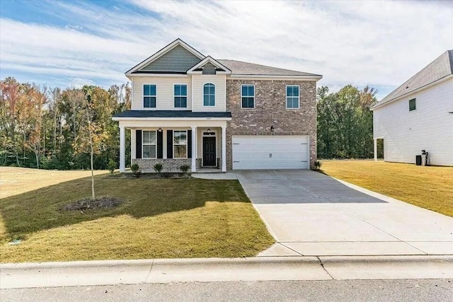 view of front of property featuring a front yard and a garage