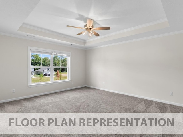 carpeted spare room with a raised ceiling, ceiling fan, and ornamental molding