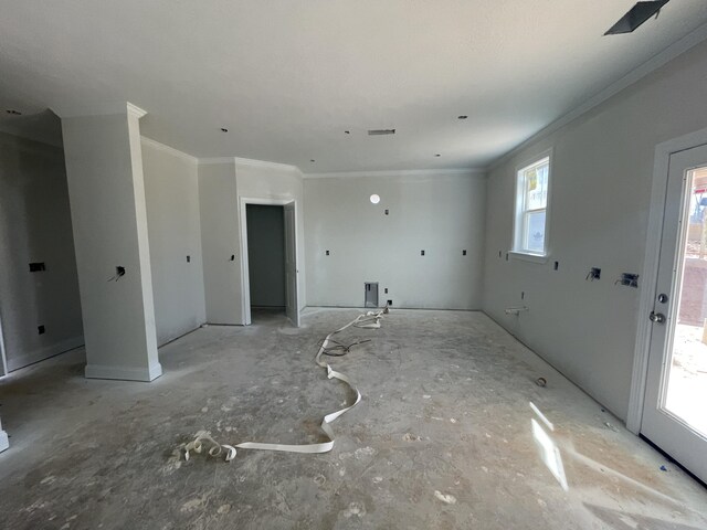 unfurnished dining area featuring crown molding and an inviting chandelier