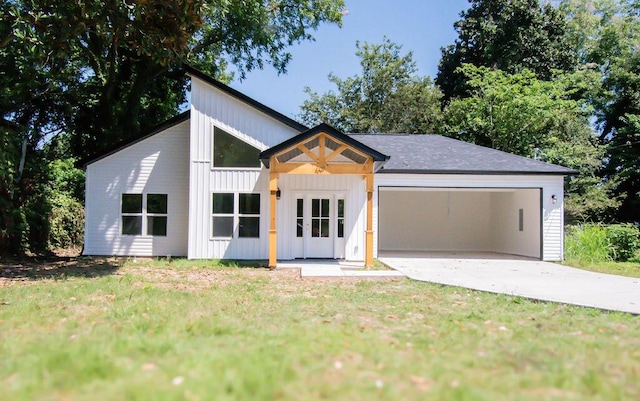 modern farmhouse style home with a front yard