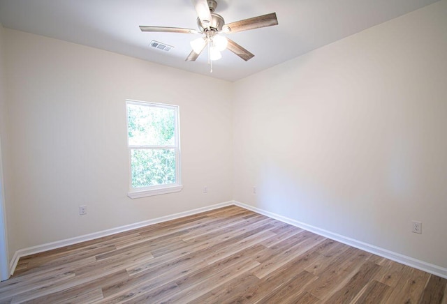 spare room featuring light hardwood / wood-style flooring and ceiling fan