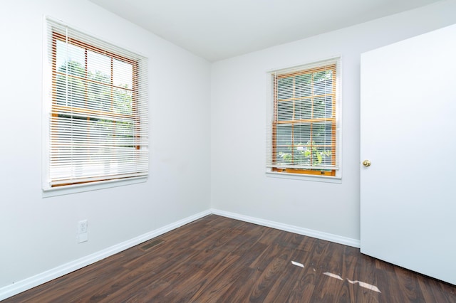 1468 Dewitt St, Augusta, GA 30901 - empty room with dark wood-style flooring and plenty of natural light