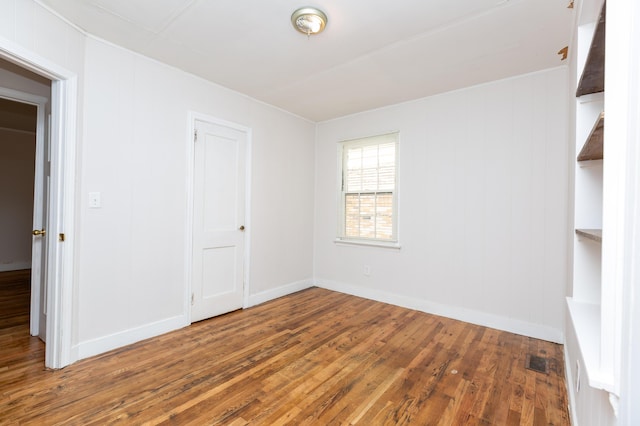 1468 Dewitt St, Augusta, GA 30901 - empty room featuring wood finished floors and baseboards