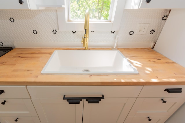 1468 Dewitt St, Augusta, GA 30901 - bathroom with a sink and decorative backsplash