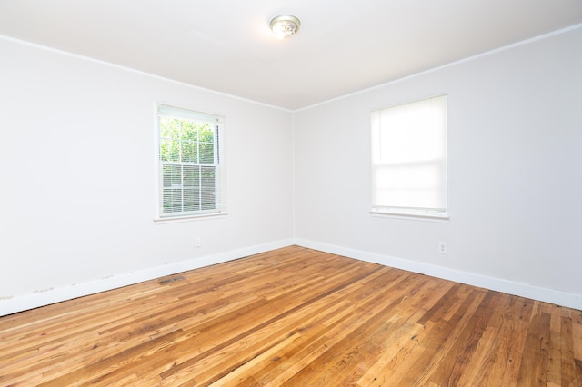 1468 Dewitt St, Augusta, GA 30901 - empty room with light wood-style floors and ornamental molding
