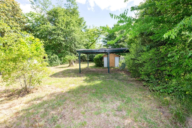 1468 Dewitt St, Augusta, GA 30901 - view of green lawn featuring a storage shed and a detached carport