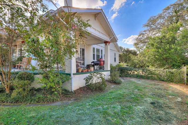 view of home's exterior with a lawn