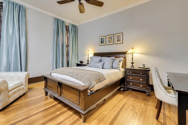 bedroom featuring ceiling fan, light hardwood / wood-style floors, and ornamental molding