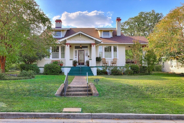 view of front facade with a porch and a front lawn