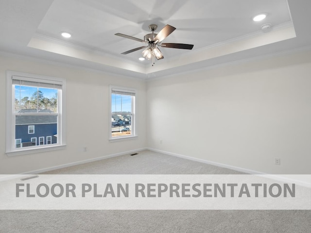 spare room featuring a raised ceiling, carpet floors, ornamental molding, a ceiling fan, and recessed lighting
