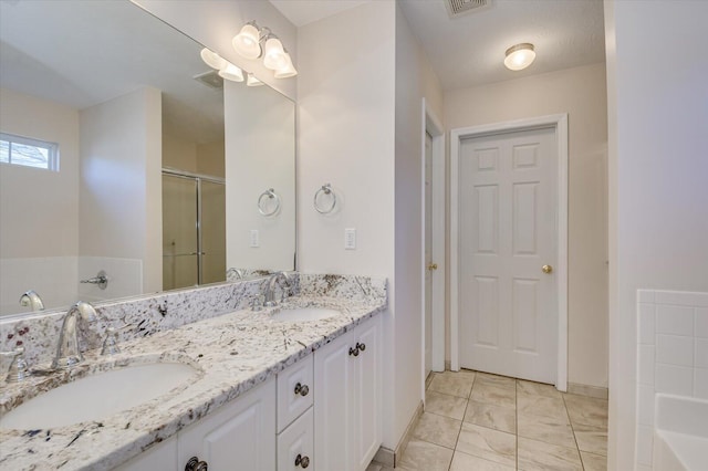 bathroom featuring plus walk in shower and vanity