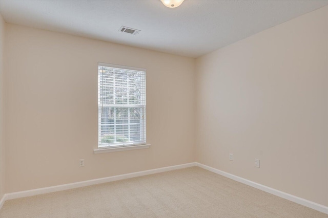 spare room featuring carpet floors