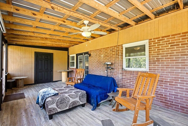 sunroom with a ceiling fan